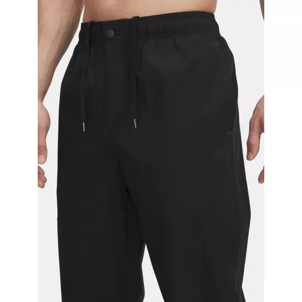  Pantaloni sport pentru bărbați UNDER ARMOUR UA UNSTPBLE WOVEN TX TAPER 6003865-001 NEGRU 