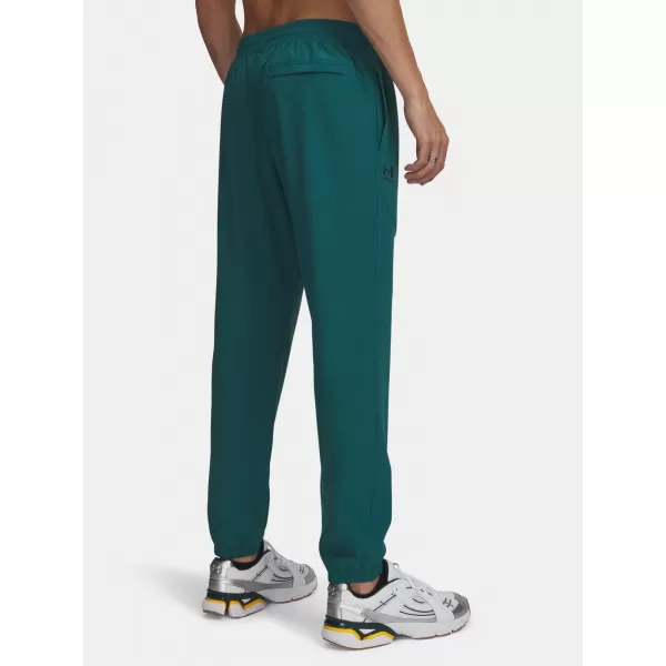  Pantaloni de trening pentru bărbați UNDER ARMOUR VIBE WOVEN JOGGER 1386557-338 VERDE 