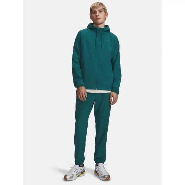  Pantaloni de trening pentru bărbați UNDER ARMOUR VIBE WOVEN JOGGER 1386557-338 VERDE 