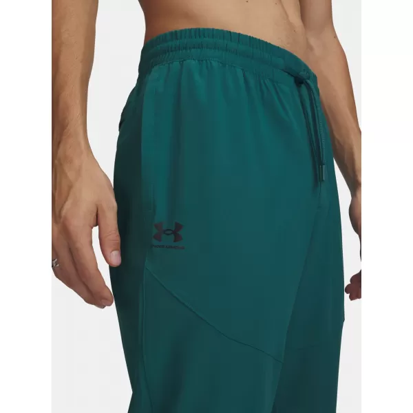  Pantaloni de trening pentru bărbați UNDER ARMOUR VIBE WOVEN JOGGER 1386557-338 VERDE 