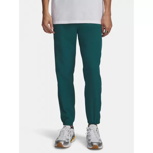  Pantaloni de trening pentru bărbați UNDER ARMOUR VIBE WOVEN JOGGER 1386557-338 VERDE 