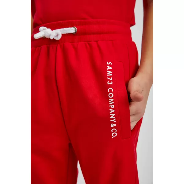  Pantaloni de trening pentru copii SAM 73 KANZ KK 518 ROŞU 