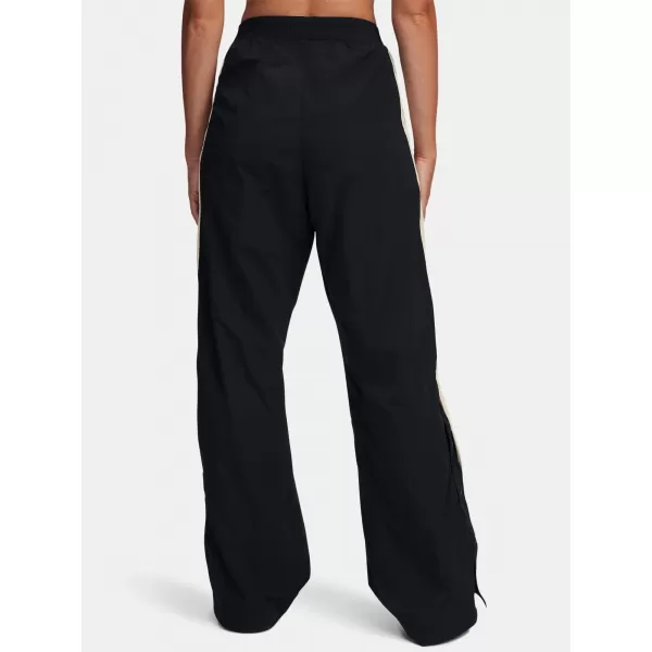  Pantaloni sport de damă UNDER ARMOUR ICON CRINKLE TEAR-AWAY PANT 6000277-001 NEGRU 