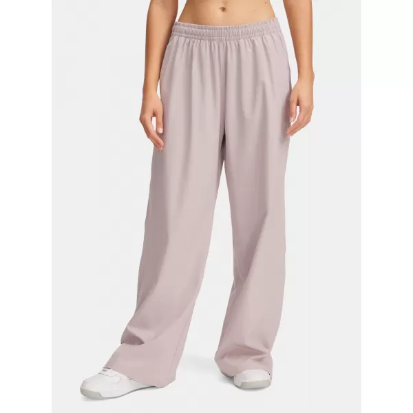  Pantaloni sport de damă UNDER ARMOUR RIVAL WIDE LEG PANT 1386453-009 GRI 