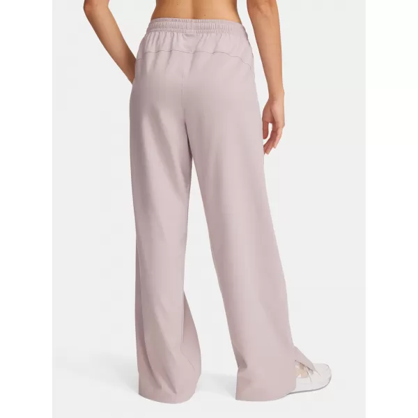  Pantaloni sport de damă UNDER ARMOUR RIVAL WIDE LEG PANT 1386453-009 GRI 
