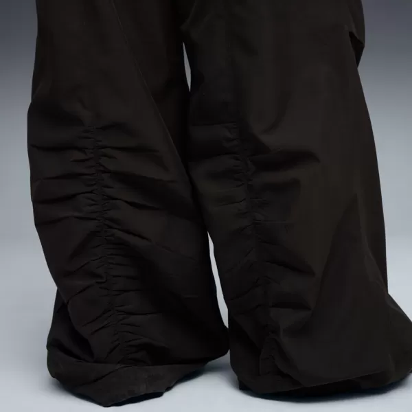  Pantalonii pentru doamne PUMA WARDROBE ESS PARACHUTE WOVEN PANTS OP 632044-01 NEGRU 