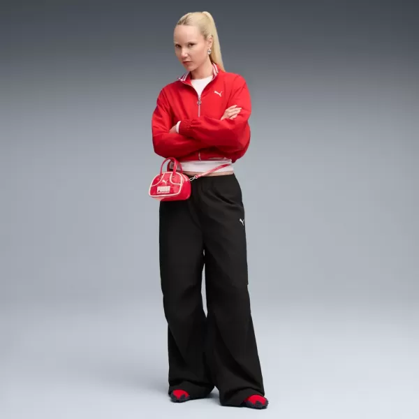  Pantalonii pentru doamne PUMA WARDROBE ESS PARACHUTE WOVEN PANTS OP 632044-01 NEGRU 