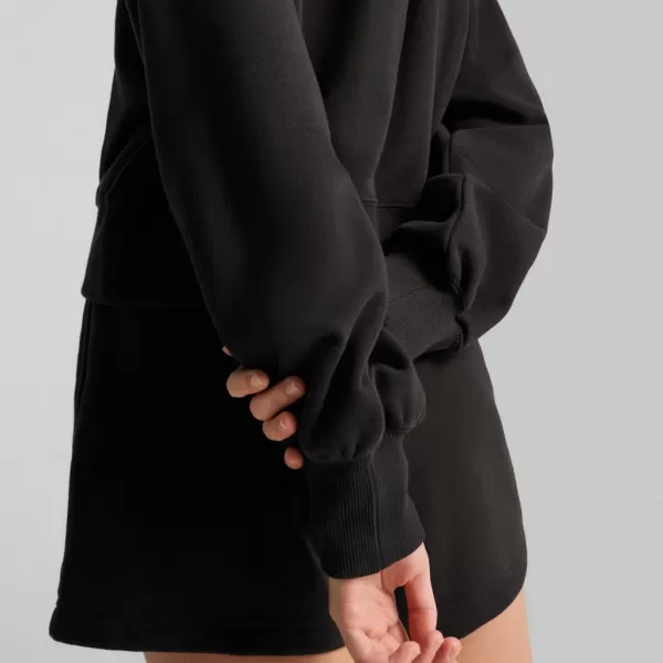  Panoul pentru doamne PUMA WARDROBE ESS RELAXED CROPPED HOODIE TR 629746-01 NEGRU 